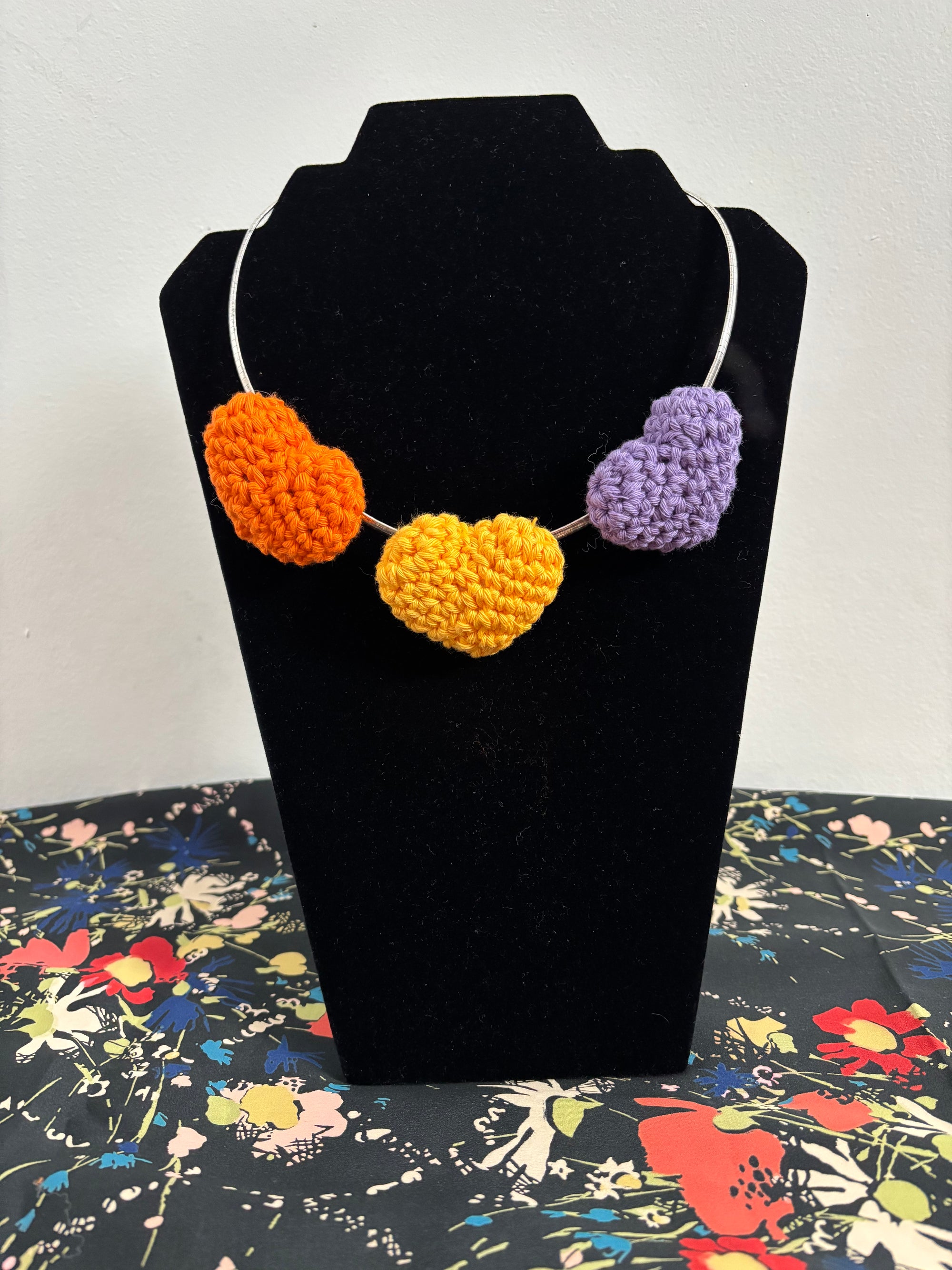 Three crochet hearts on an omega chain necklace